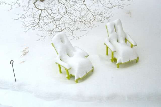 chairs in garden in snow